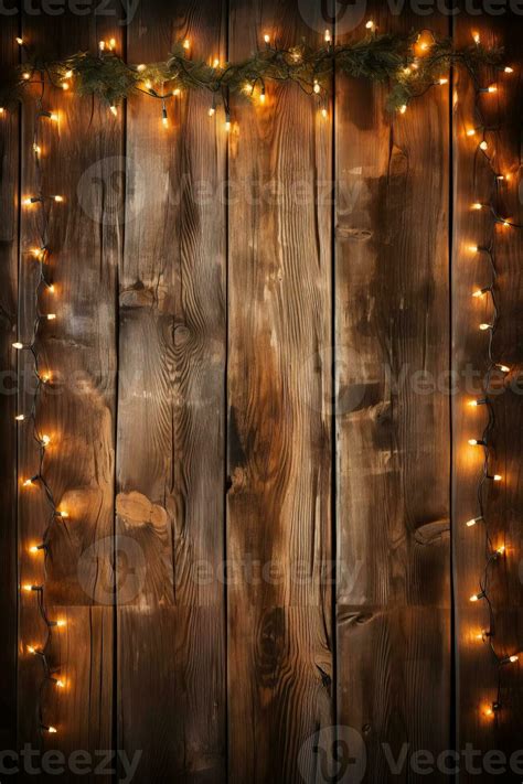 Retro-style Christmas lights and garlands illuminating a rustic wood ...