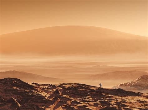 Olympus Mons. On Mars a lone astronaut from Earth explores the area ...