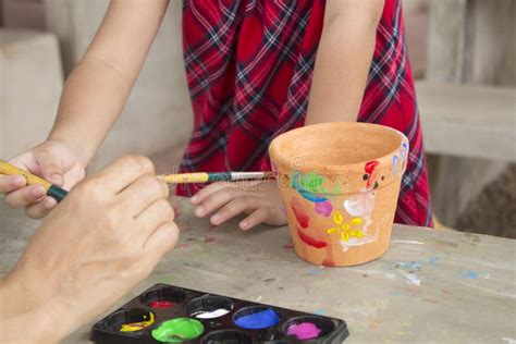 Child Painting Pot with Water Color Stock Photo - Image of ceramic ...