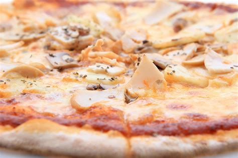 Pizza funghi with extra mushrooms 9565903 Stock Photo at Vecteezy