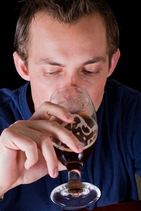 Man drinking a beer stock image. Image of brewed, black - 29309849