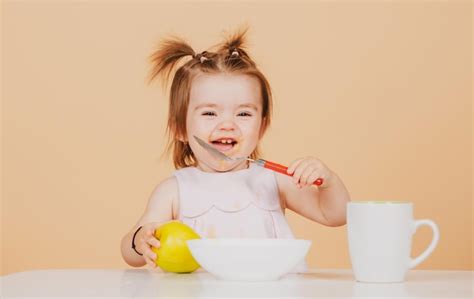 Premium Photo | Cute funny babies eating baby food funny smiling baby ...