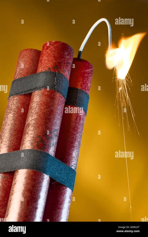 Dynamite sticks with lit fuse Stock Photo - Alamy