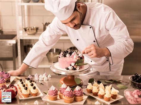 a chef is decorating cupcakes on a table with other desserts in the background