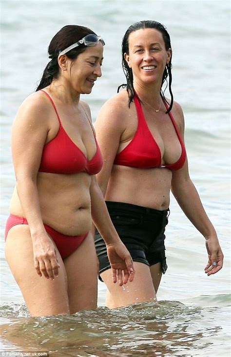 Alanis Morissette shows off her healthy beach body in a red bikini in ...