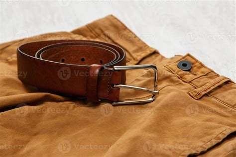 Leather brown belt 16290164 Stock Photo at Vecteezy