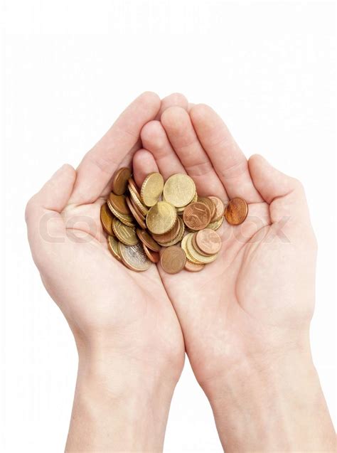 Male hands holding coins isolated on white | Stock image | Colourbox