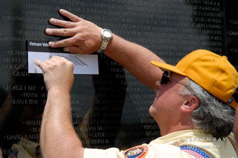 Photo: Pencil rubbing by volunteer. Vietnam Veteran's Memorial Wall, Washington, D.C., USA.