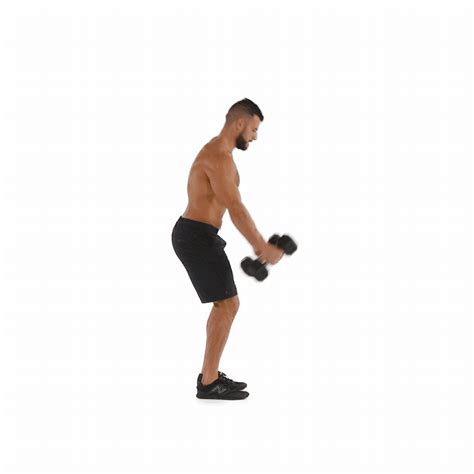 Hold a pair of dumbbells at arm’s length next to your thighs. Start in... | Kettlebell training ...