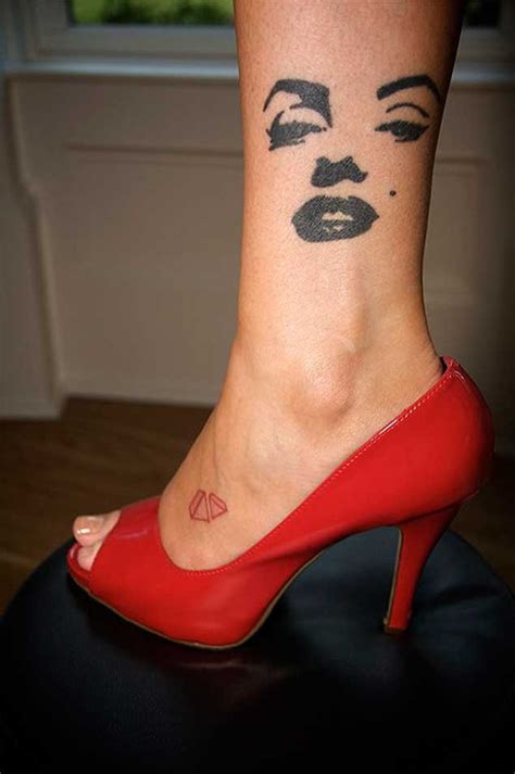 Merlin Monroe"s silhouette face dark black ink elegant tattoo on lady"s ankle - Tattooimages.biz