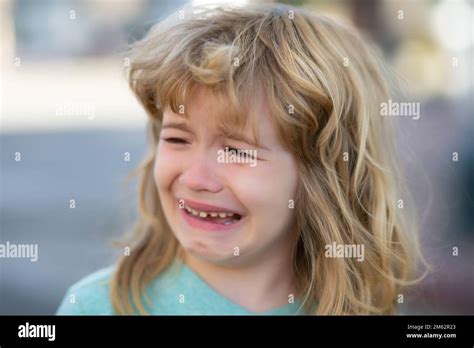 Portrait of crying kid with tears weeping emotion, hurt in pain. Tear ...