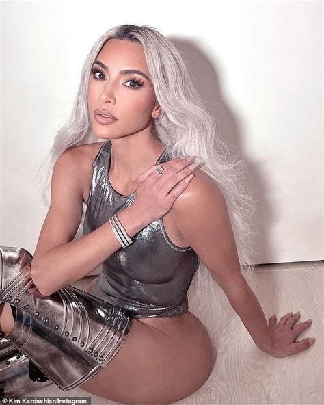 Kim Kardashian shows off her slim physique in a breathtaking silver ...