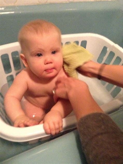 In a pinch, bathe baby in a laundry basket! Clean, protective and keeps toys in reach. | Laundry ...