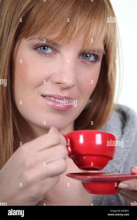 Woman with red coffee cup Stock Photo - Alamy