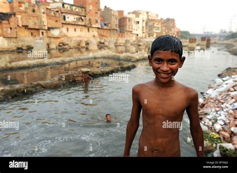 Children swimming in dirty water in India's capital New Delhi Stock Photo - Alamy