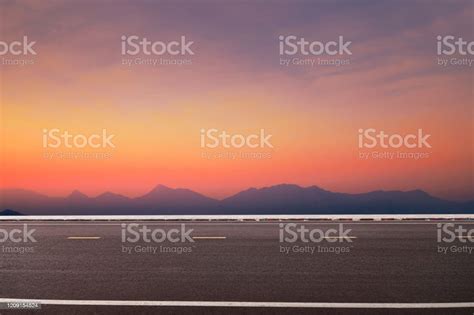 Photo Of Side View Natural Sunset Road Stock Photo - Download Image Now ...