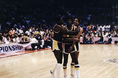 Magic Johnson celebrates with teammates after beating the Philadelphia ...