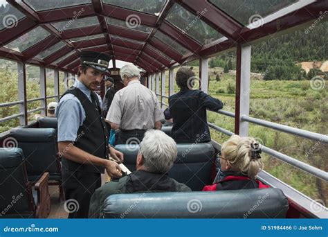 Brakeman Takes Tickes on Durango and Silverton Narrow Gauge Railroad Featuring Steam Engine ...