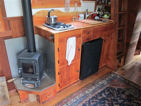 an old fashioned stove in the corner of a kitchen