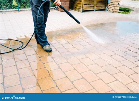 Outdoor Floor Cleaning with High Pressure Water Jet - Cleaning C Stock ...