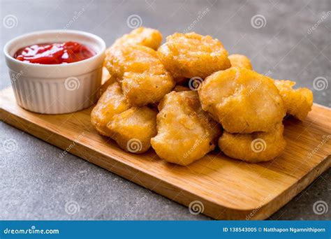 Chicken nuggets with sauce stock image. Image of view - 138543005