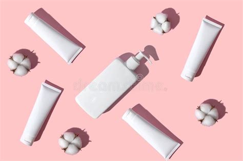 White Cotton Flowers and a White Body Hygiene Dispenser on a Pink Background. Stock Image ...