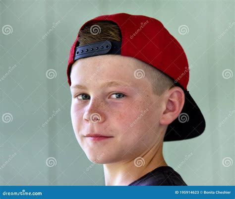 Baseball Cap Turned Backwards Stock Image - Image of grin, baseball: 195914623