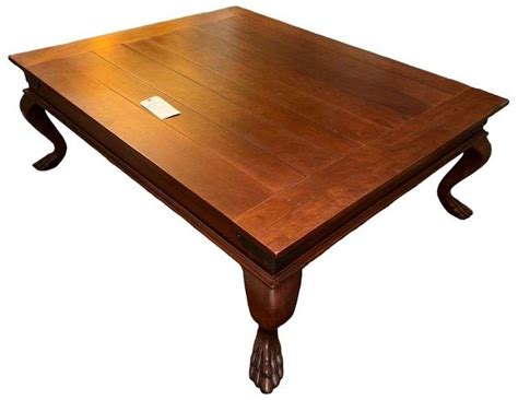 CHERRY? COFFEE TABLE W/ CLAW FEET & NICE ORNATE HAMMERED METAL TRIM ON CORNERS - DeLozier Realty ...