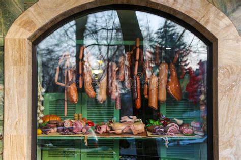 Vibrant Butcher Shop Display Showing Various Meat with Tree Reflections Stock Photo - Image of ...