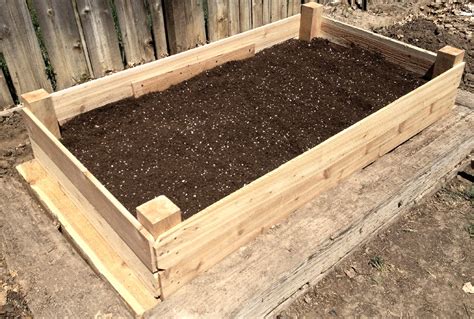 How To Fill a Raised Garden Bed with Soil Layers