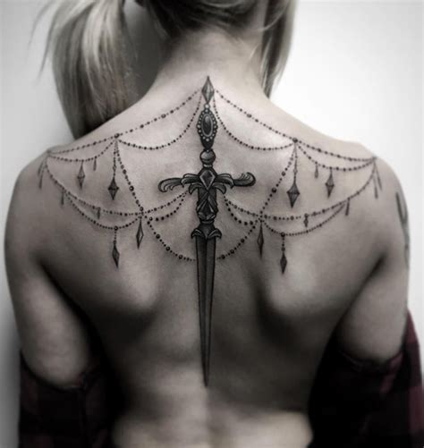 50 Amazing Sword, Dagger, and Knife Tattoo Designs - TattooBlend