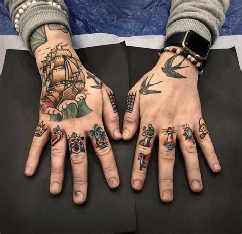 Finger Tattoo for Men | Traditional hand tattoo, Hand tattoos for guys, Hand and finger tattoos