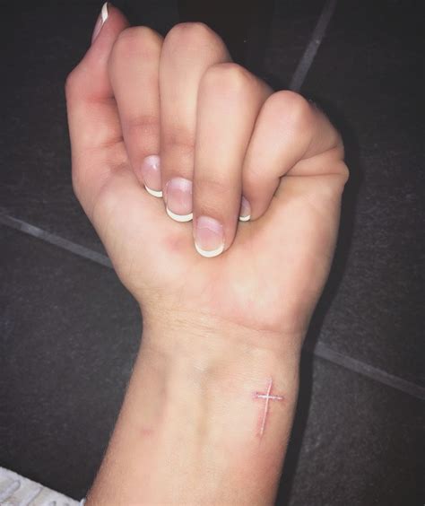 White Cross Tattoo on Wrist Faith Cross Tattoos, Cross Tattoo Meaning, Unique Cross Tattoos ...