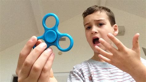 Attempting fidget spinner tricks!!! - YouTube