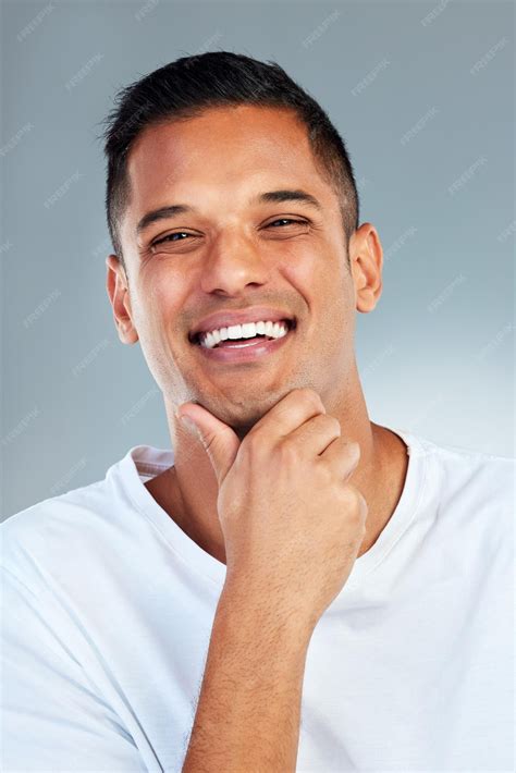 Premium Photo | Man portrait and smile with teeth in fresh or clean hygiene against a grey ...