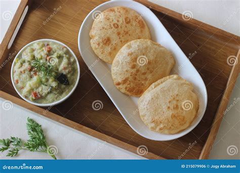 Deep Fried Indian Flat Bread Served with Mixed Vegetable Curry in a ...