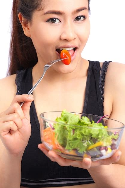 Premium Photo | Pretty girl eating healthy food