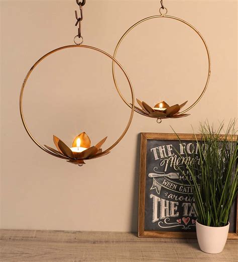 Buy Round Gold Set Of 2 Metal Hanging Tea Light-Holder at 27% OFF by Amaya Decors | Pepperfry