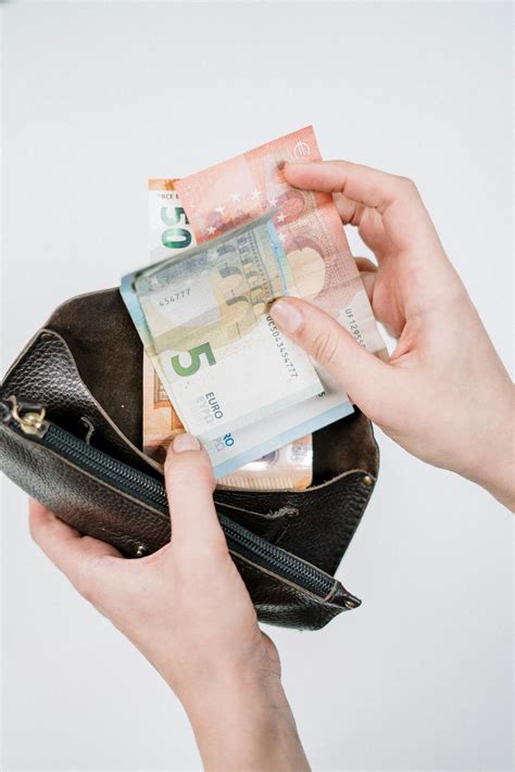 20 Banknote on Black Leather Bag · Free Stock Photo