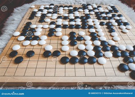 Go or Weiqi board game stock image. Image of black, game - 68824315