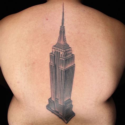 Natural looking black and white back tattoo of Empire State Building - Tattooimages.biz