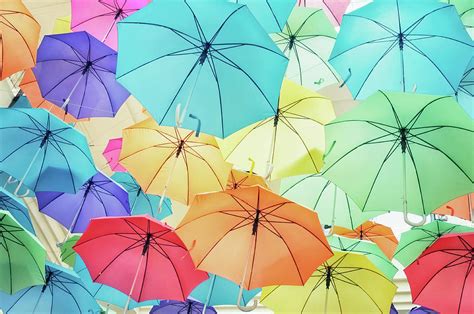 Brightly Coloured Umbrellas In The Sky by Sharon Lapkin