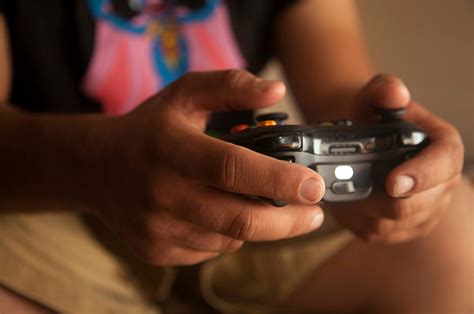 Person Holding Black Game Controller · Free Stock Photo