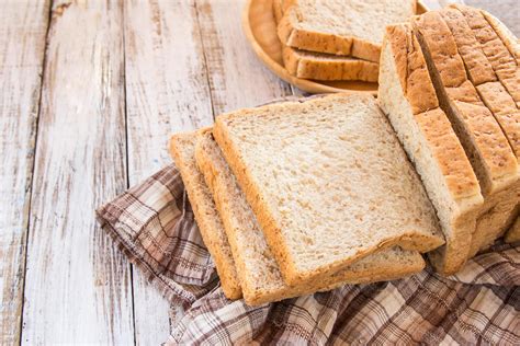 Whole wheat bread on white wooden background 6426104 Stock Photo at ...