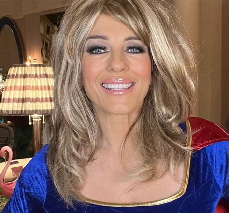 Elizabeth Hurley, 56, is a sexy Supergirl in a blond wig