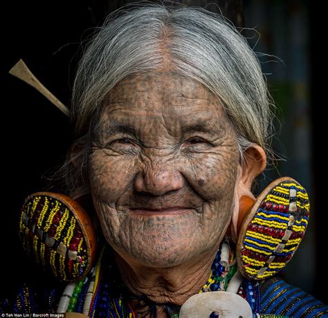 Burma's Chin tribe where women wear huge earrings and face tattoos as part of tradition | Daily ...