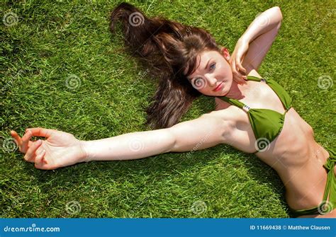 Bikini Model Lying Down on Grass