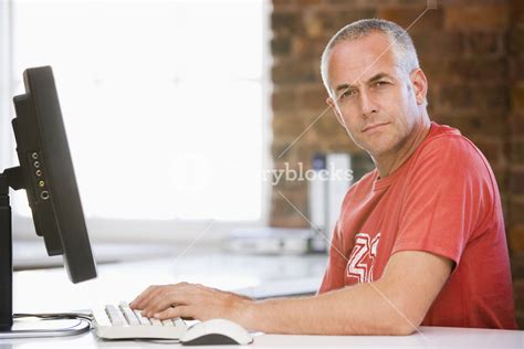 Businessman in office typing on computer Royalty-Free Stock Image ...