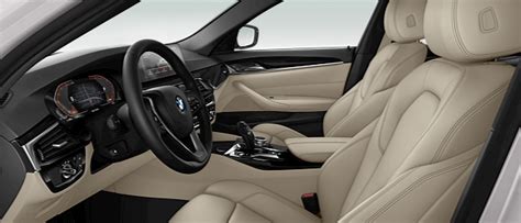 Interior shot of 2020 BMW 530i Sedan with Canberra Beige/Black SensaTec ...