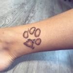 People are "Branding" Themselves with Dog Paw Tattoos
